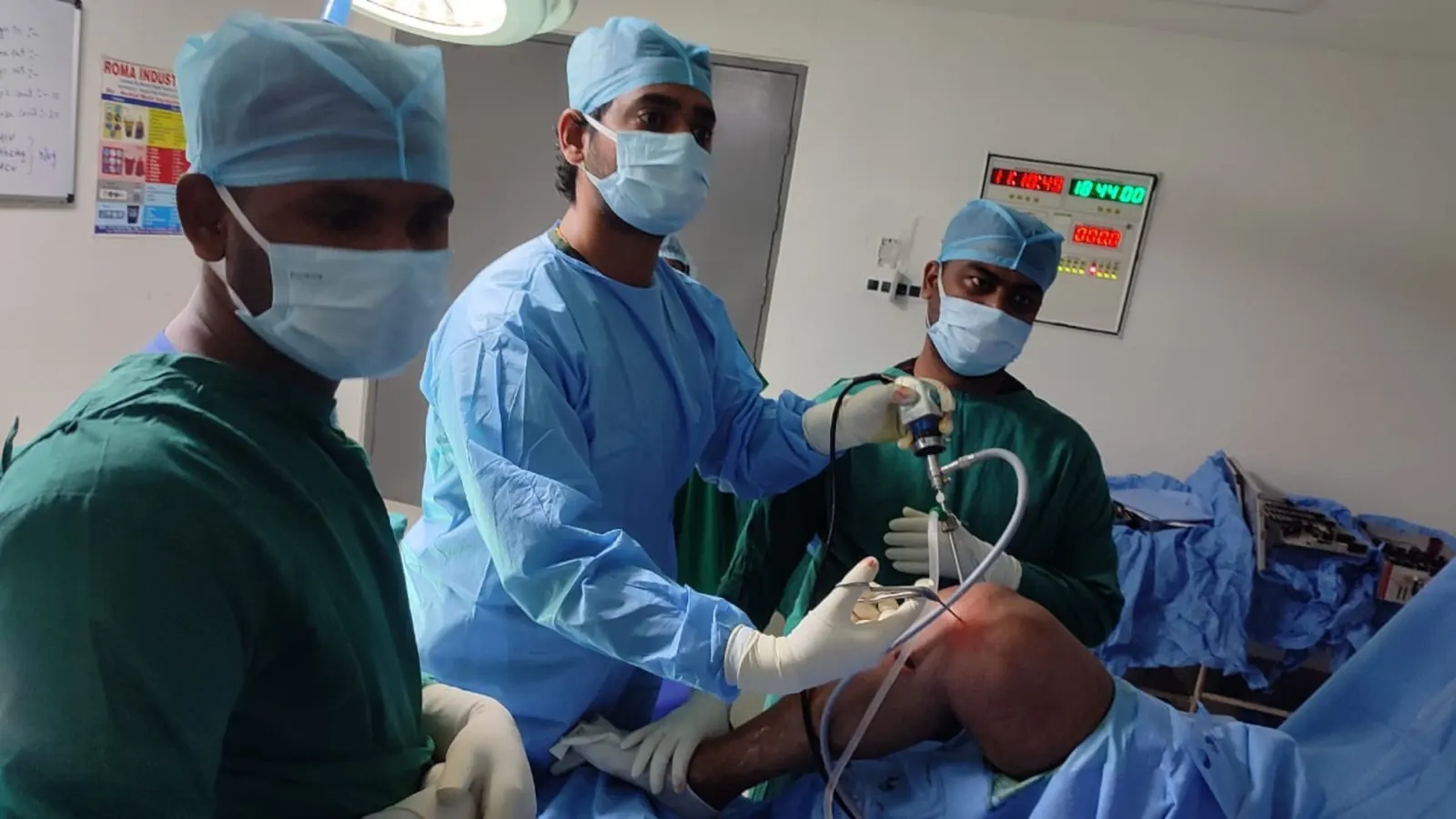 Dr. Arun Dev performing key hole knee surgery with his team