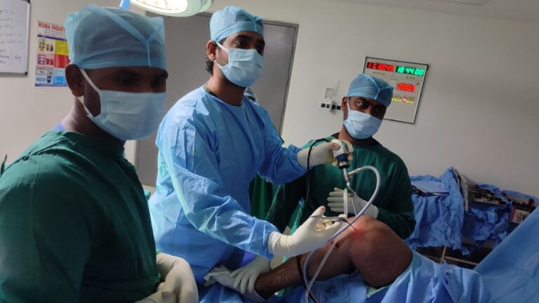 Dr. Arun Dev during a knee procedure